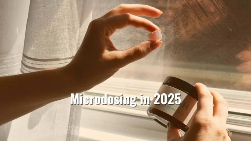 Person holding a small cannabis gummy next to a jar, with sunlight streaming through a window and the title Microdosing in 2025